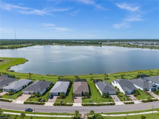 Aerial view of residential area featuring a large body of water