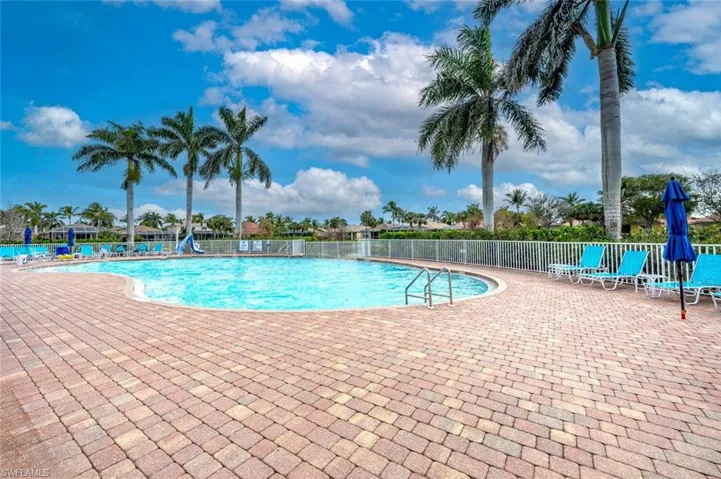 Community pool featuring a patio