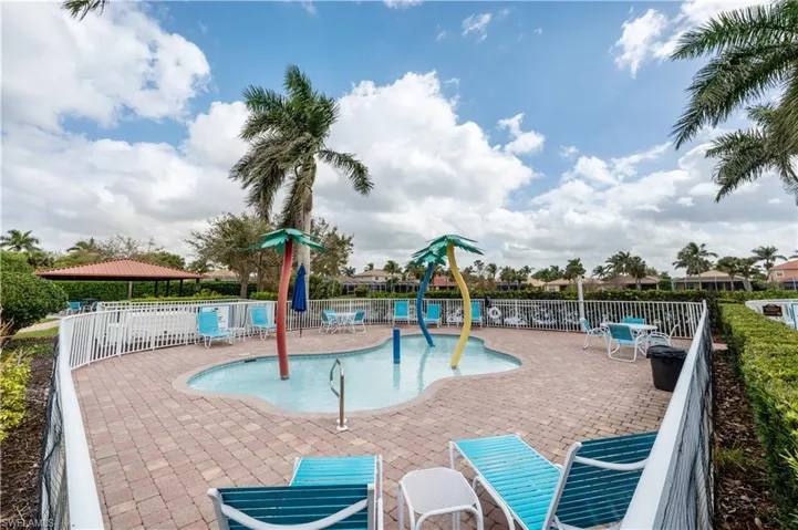 View of jungle gym featuring a community pool and a patio area
