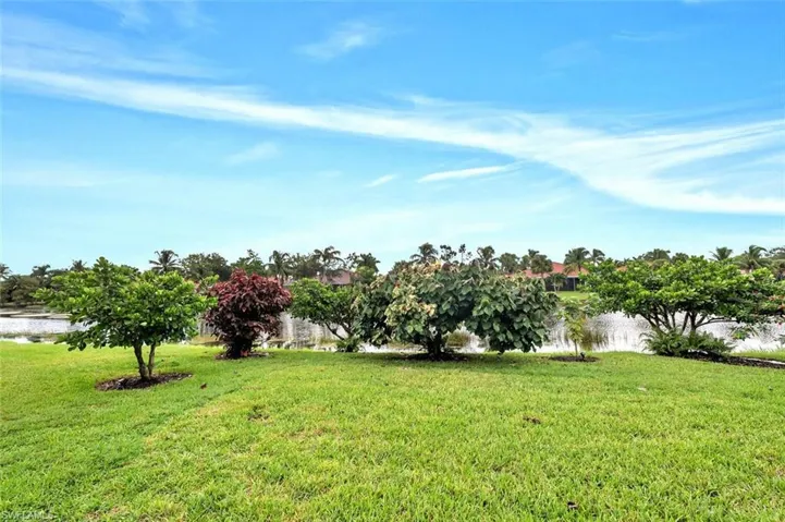 View of grassy yard featuring a water view