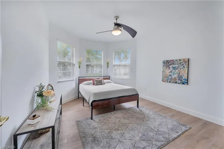 Bedroom featuring light wood-type flooring and a ceiling fan