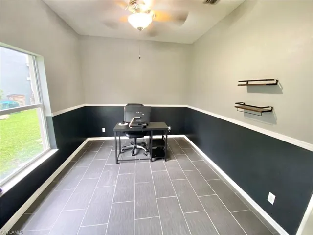 Office with ceiling fan and hardwood / wood-style floors