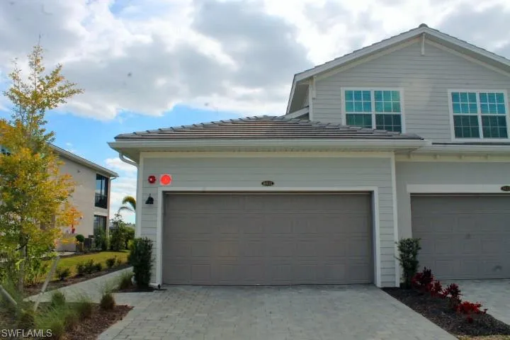 Beautiful lot overlooking the water & 16th green. 2 car garage