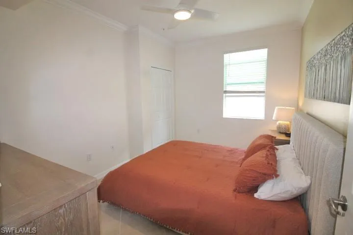 3rd Bedroom featuring moldings, blinds and ceiling fan