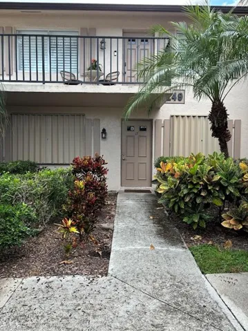 Entrance to property featuring a balcony