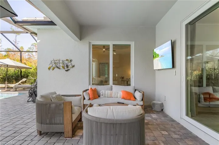 View of patio / terrace with a lanai and a pool