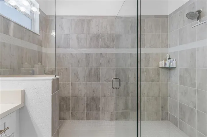 Bathroom featuring vanity and walk in shower