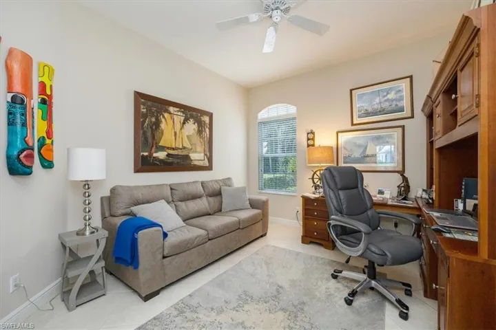 Tiled office with baseboards and ceiling fan