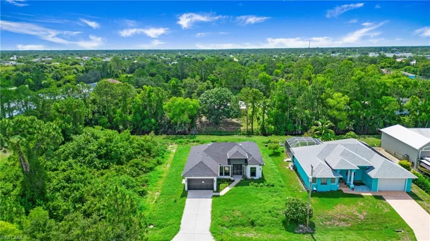View from above of property with a heavily wooded area