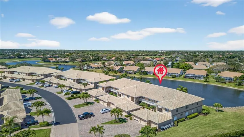 Aerial perspective of suburban area with a large body of water