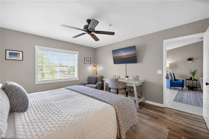 Bedroom featuring wood finished floors and a ceiling fan