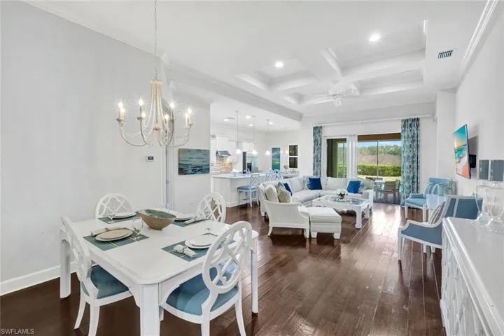 Dining area, great room with family room/open kitchen and breakfast nook with access to outdoor area via sliding glass doors.