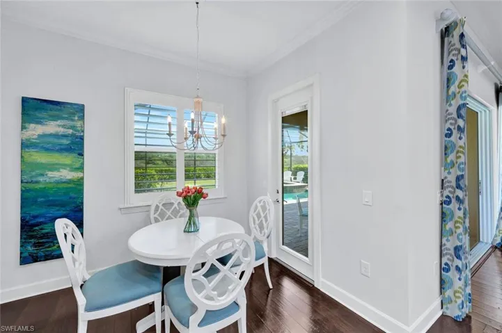Breakfast nook with access to the outdoor lanai (pool, spa and covered area).