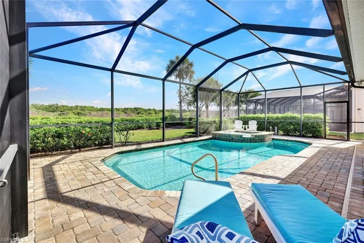 View from lounge chairs of the pool, preserve and spa.