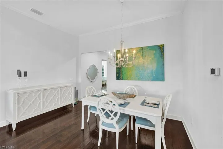 Dining area with with hallway to front door gueset bedroom #3.