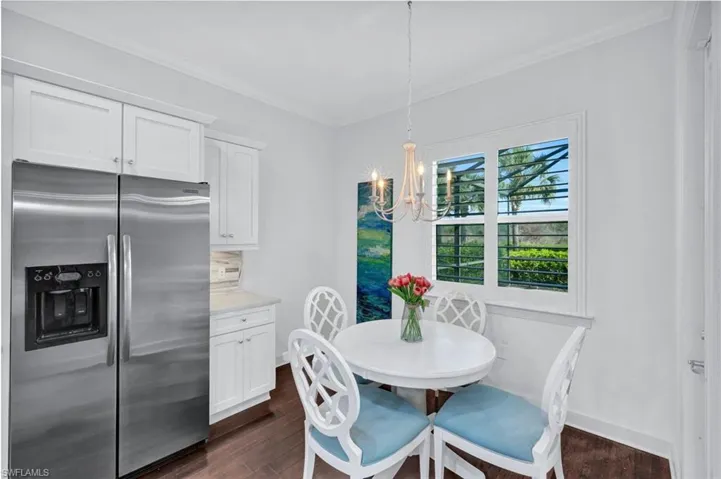Breakfast nook with access to the outdoor lanai (pool, spa and covered area).