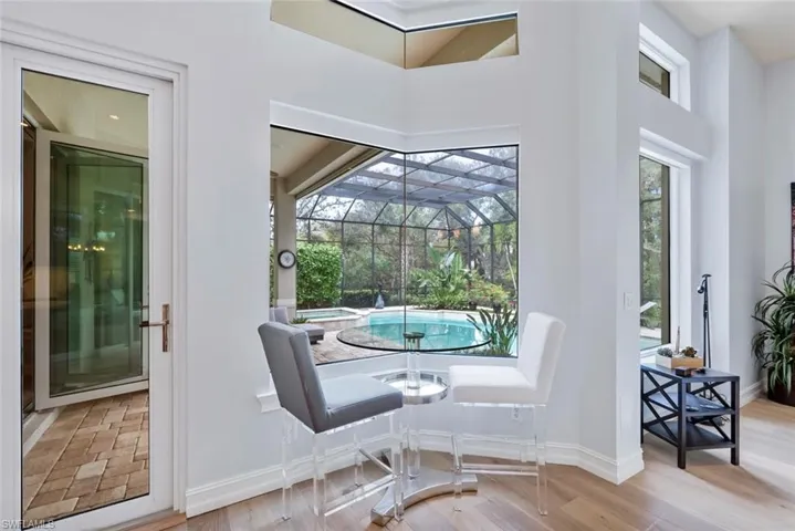 Dining space with wood finished floors and baseboards