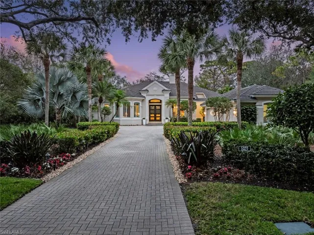 View of front of house with french doors and stucco siding
