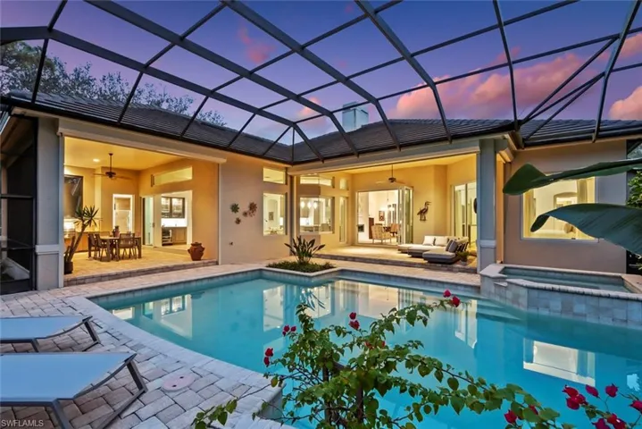 View of pool with a ceiling fan, a patio, and a pool with connected hot tub