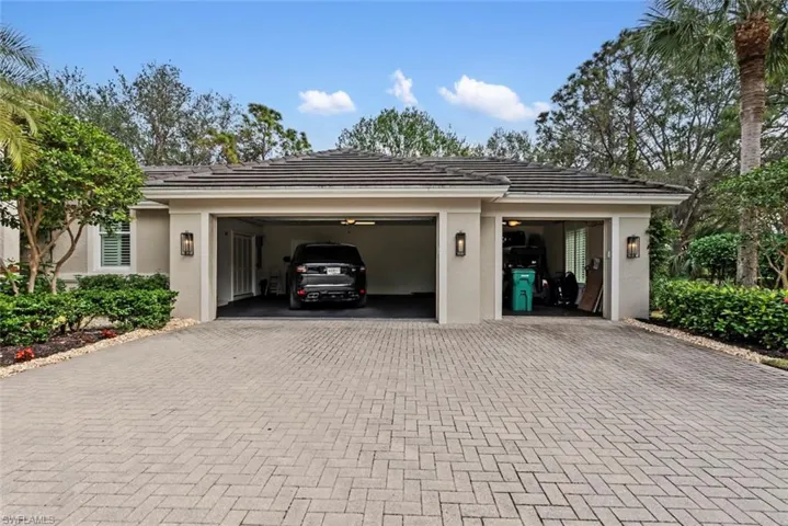 Garage with decorative driveway