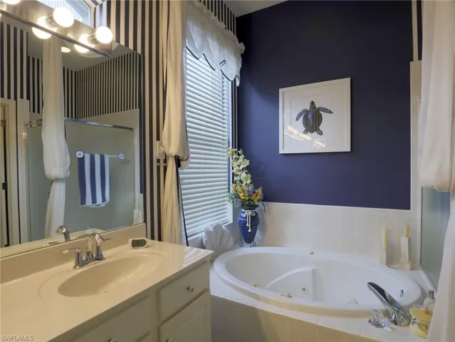 A jetted tub and large walk in shower