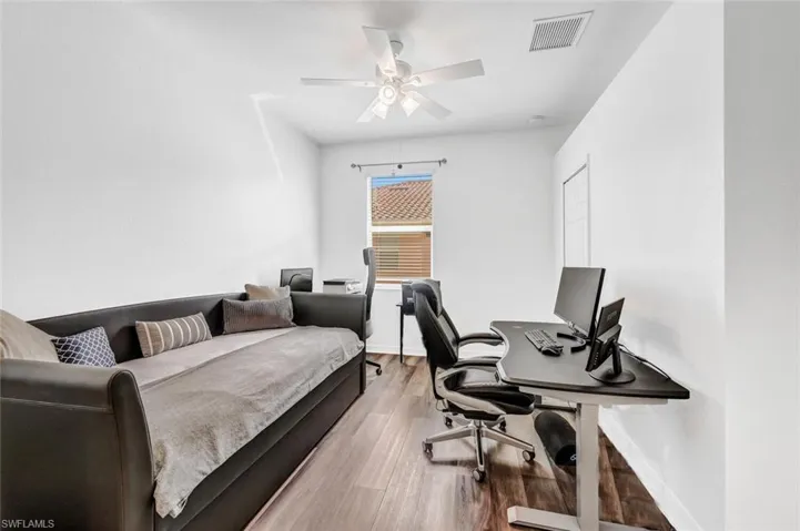 Office featuring ceiling fan and light wood-type flooring