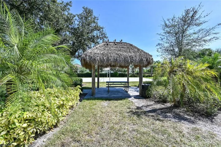 Surrounding community featuring a gazebo, a water view, and a patio area