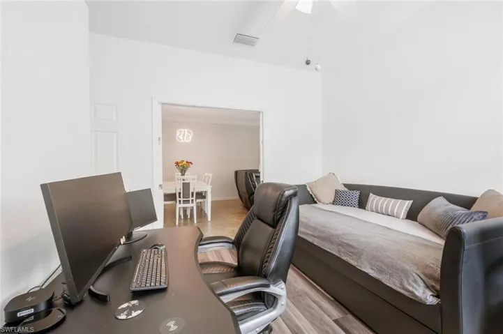 Bedroom with ceiling fan and light hardwood / wood-style floors