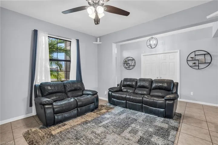 Tiled living room with ceiling fan