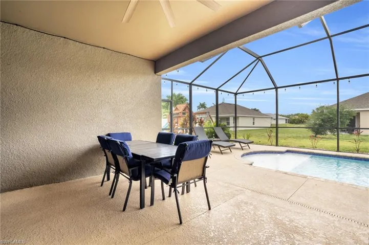 Sunroom featuring ceiling fan