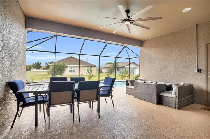 Sunroom featuring ceiling fan