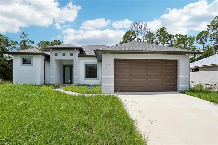 Prairie-style home with a front lawn