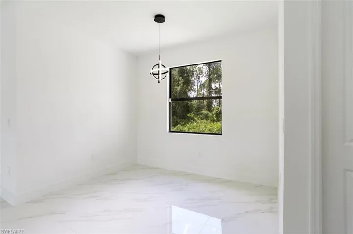 Spare room with tile flooring