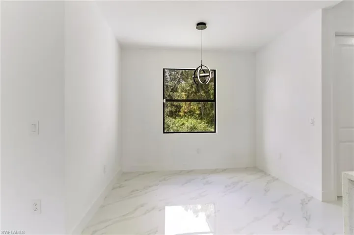 Unfurnished room with tile floors