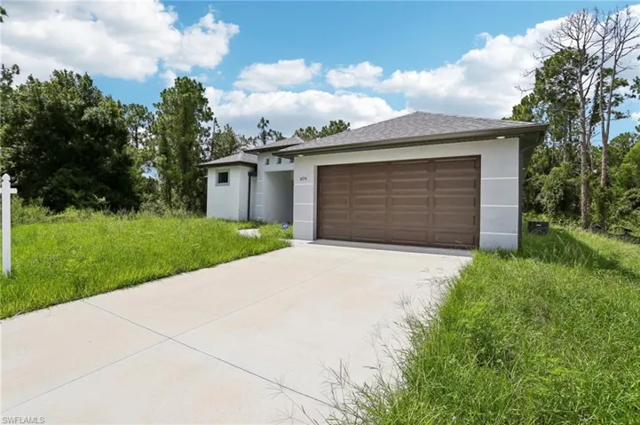 View of front of property featuring a garage