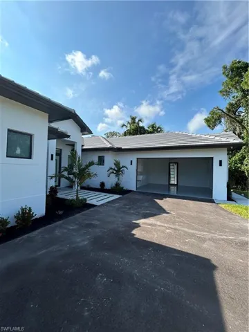 View of front of home featuring a garage