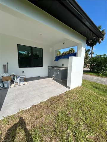 View of patio featuring sink and an outdoor kitchen