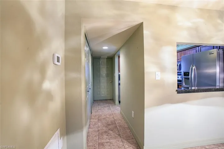 Corridor featuring baseboards