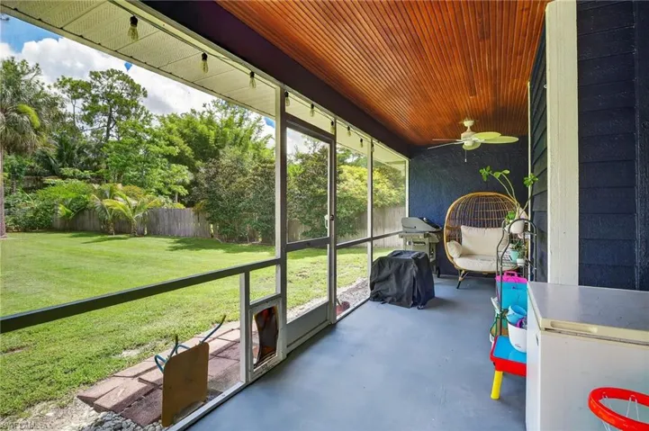 Sunroom featuring ceiling fan