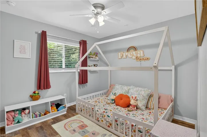 Bedroom featuring wood finished floors and a ceiling fan