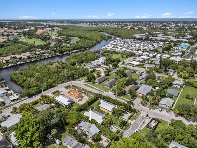Birds eye view of property with a water view