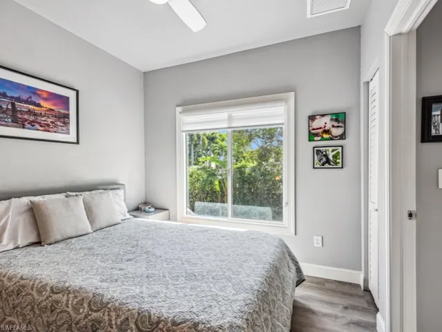 Guest-Bedroom featuring ceiling fan and hardwood / wood-style floors