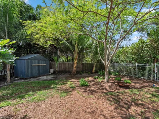 View of yard featuring a storage unit