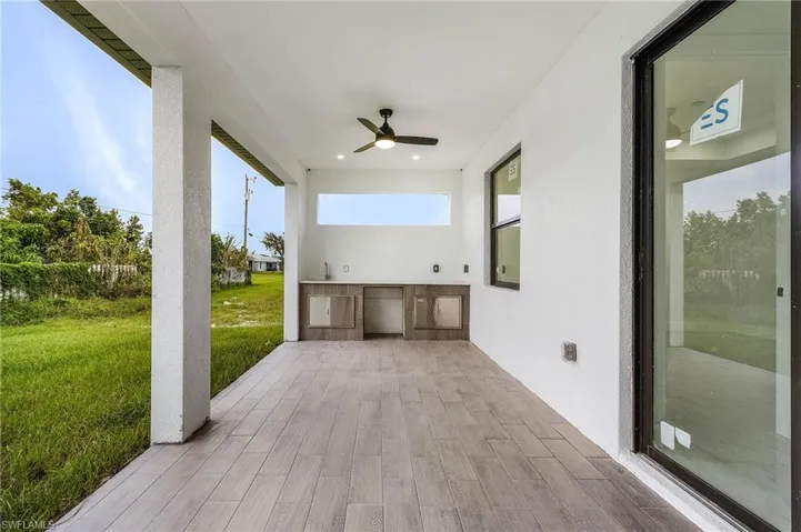View of patio / terrace with area for grilling and ceiling fan