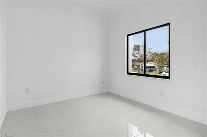 Unfurnished room with plenty of natural light