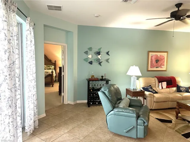 Interior space featuring tiled flooring and light blue wall tones