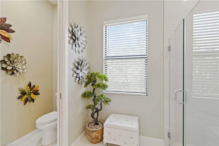 Full bath featuring a stall shower and tile patterned flooring