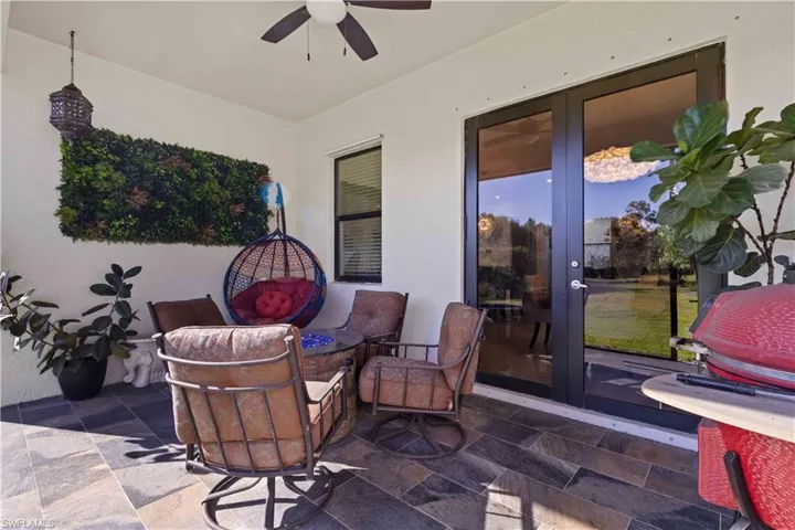 View of patio / terrace with an outdoor fire pit and ceiling fan