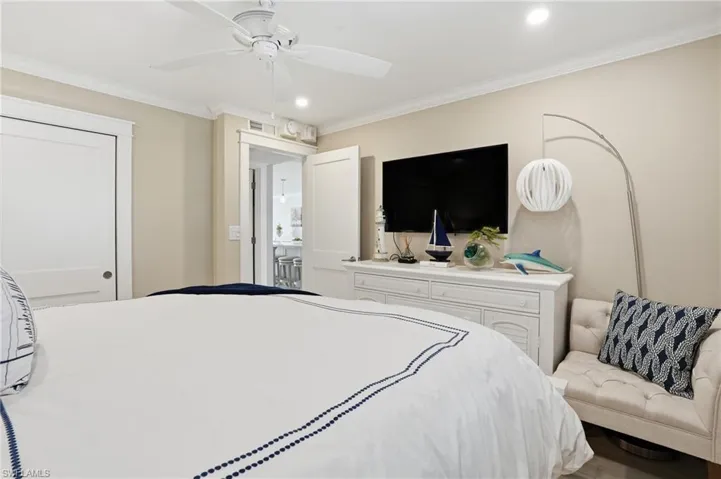 Bedroom featuring ornamental molding, ceiling fan, and recessed lighting