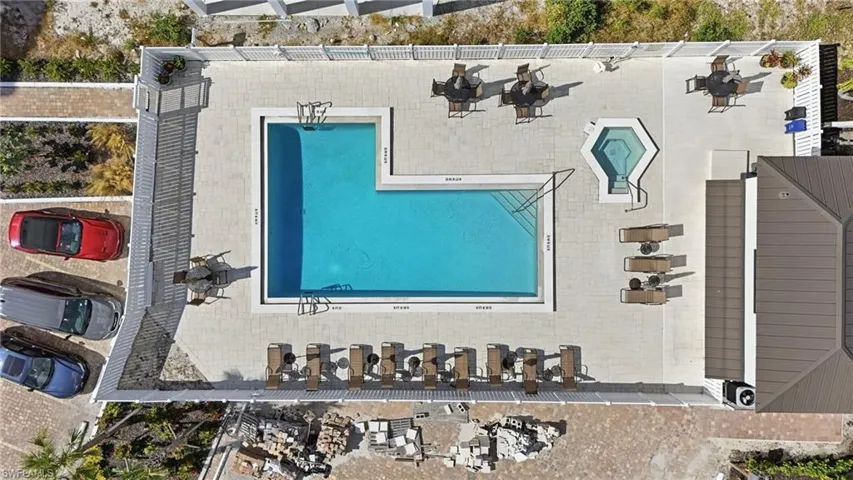 Aerial view of property and surrounding area with a pool